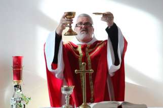 Bishop-elect Scott McCaig celebrates Mass at the St. Therese School.