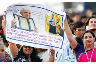 Pilgrims from Goa, India, hold a sign thanking Pope Francis before the canonization Mass of St. Joseph Vaz at Galle Face Green in Colombo, Sri Lanka, Jan. 14. St. Vaz was born in Goa. 