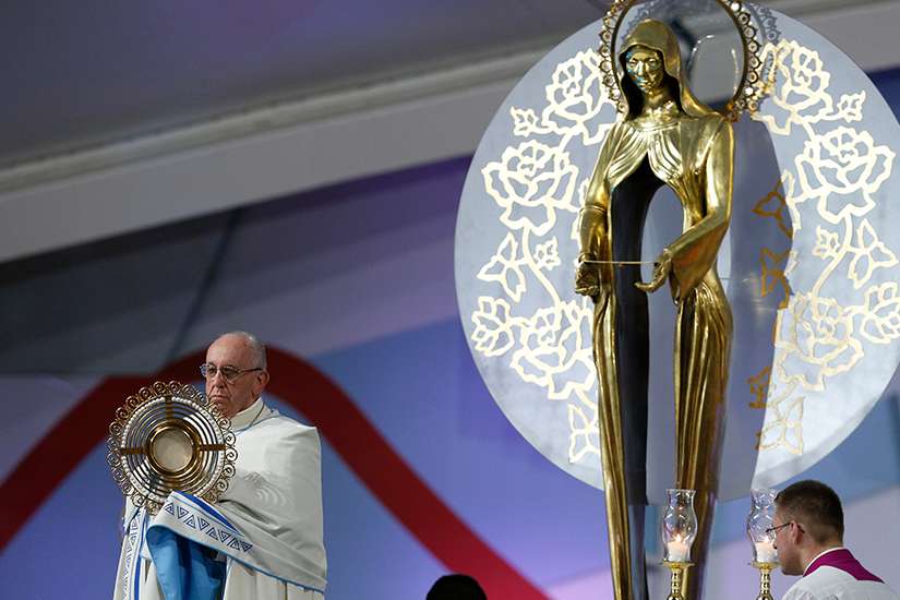 Pope Francis blesses the crowd with the monstrance during the World Youth Day prayer vigil at St. John Paul II Field in Panama City Jan. 26, 2019. 