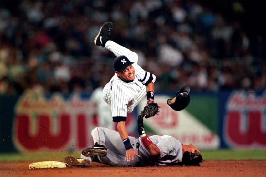 Derek Jeter, being upended as he turns a double play, above, along with Henry Aaron and Yogi Berra were chosen to the all-time Catholic baseball all-star team in a ballot hosted by Catholic Athletes for Christ.