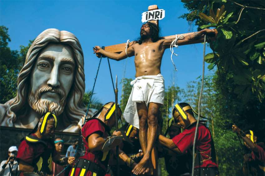 Catholic worshippers take part in a reenactment of the Way of the Cross in Yogyakarta, Indonesia, on Good Friday.