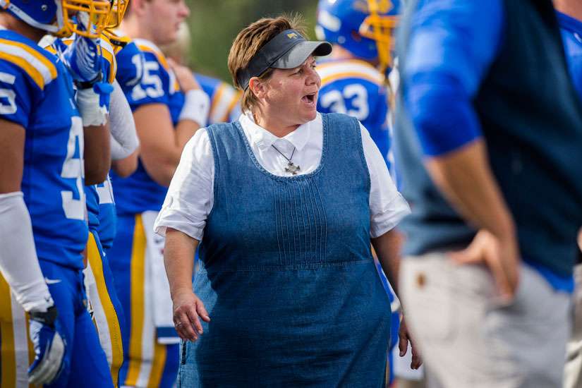 Benedictine Sister Lisa Maurer, who coaches kickers and punters for The College of St. Scholastica Saints football team in Duluth, Minn., is pictured during a game in late September. Sister Lisa joined the monastery at St. Scholastica seven years ago, one year before the school established a football program.
