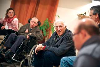 Jean Vanier is pictured during a visit with members of the L’Arche coummunity in March 2011.
