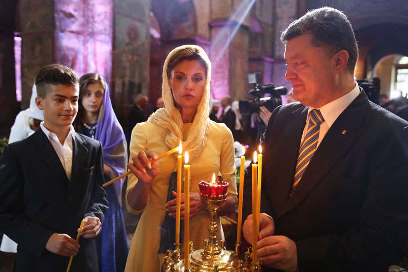 Ukraine&#039;s President Petro Poroshenko, his wife Maryna and son Mykhailo, light candles in this photo dated Aug. 23, 2014.  On Nov. 20, Pope Francis met with Ukrainian President Petro Poroshenko at the Vatican.