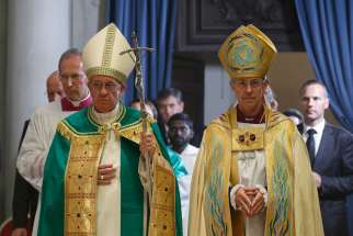 Pope Francis and Anglican Archbishop Justin Welby of Canterbury, England, spiritual leader of the Anglican Communion, arrive to preside at a vespers service at the Church of St. Gregory in Rome Oct. 5.