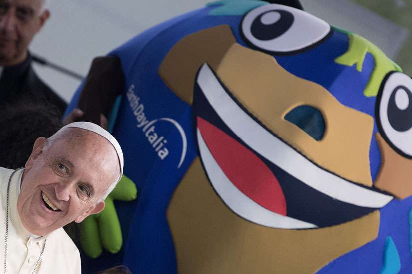 Pope Francis smiles as he attends an Earth Day celebration April 24 at Villa Borghese Garden in Rome. 