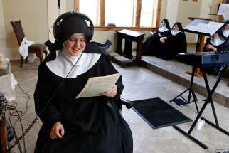 Mother Cecilia listens back to a recording while the singing nuns take a break, on February 18, 2016. The Benedictines of Mary, Queen of Apostles, are cloistered nuns who have had four albums top the charts. They released their latest album, &quot;Adoration at Ephesus,&quot; on April 26, 2016. 