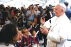 Pope Francis meets people involved with St. Maria’s Meals Program of Catholic Charities in Washington Sept. 24.