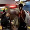 An indigenous couple waits for the train as they make their way to the People&#039;s Summit in Rio de Janeiro June 20. The summit was a parallel event of the June 20-22 U.N. Rio+20 Conference on Sustainable Development.