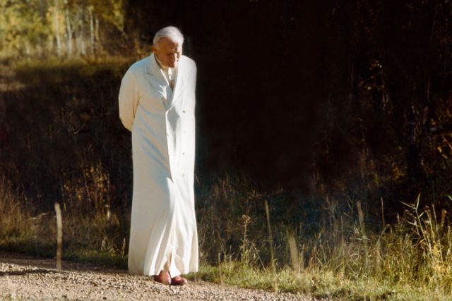 Pope John Paul II walks down a gravel path in an undated photo by Vatican photographer Arturo Mari. The Polish pontiff will be canonized April 27 with Blessed John XXIII.
