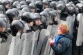 A woman addresses riot police holding shields during a rally held by pro-European Union protesters in Kiev, Ukraine, Jan. 21. 
