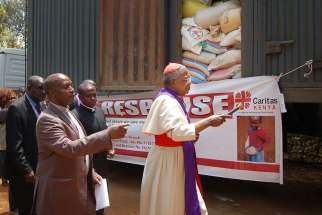 Cardinal John Njue of Nairobi, Kenya, blesses food aid March 17 that was being delivered to Isiolo and Marsabit, two dioceses affected by the drought.