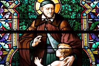 A likeness of St. Vincent de Paul is seen in stained glass at Caldwell Chapel on the campus of The Catholic University of America in Washington.