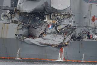 The USS Fitzgerald guided-missile destroyer, damaged by colliding with a Philippine-flagged merchant vessel, is seen June 18 at the U.S. Navy base in Yokosuka, Japan.
