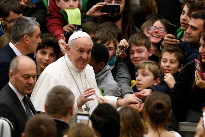 Pope Francis greets the crowd as he arrives for his general audience in Paul VI hall at the Vatican Feb. 5, 2020.