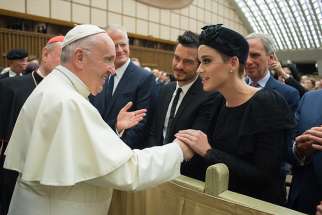 Pope Francis greets singer Katy Perry, accompanied by English actor Orlando Bloom, during an audience with people participating in the &quot;United to Cure Conference&quot; at the Vatican April 28. Hundreds of physicians, researchers and health care executives attended the April 26-28 conference to talk about medical advances and steps to promote health-care around the world.