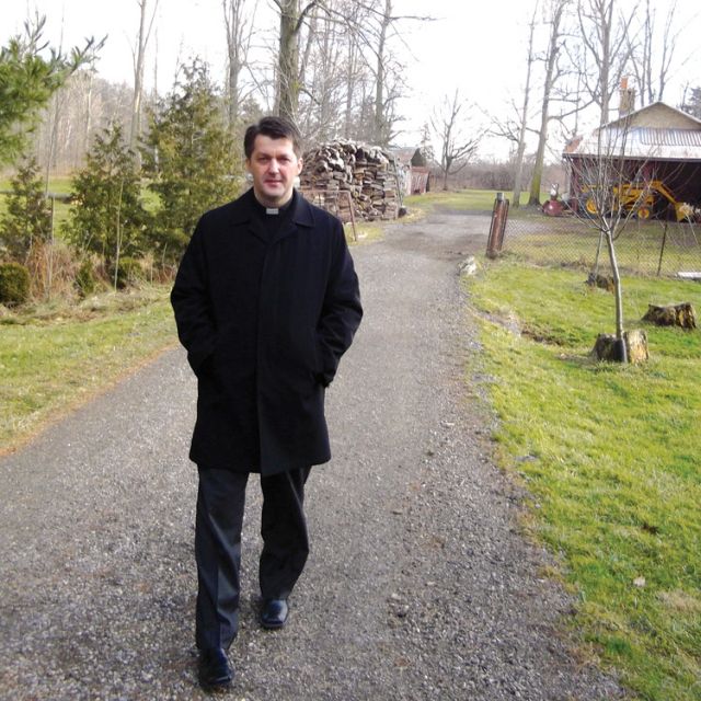 Fr. Andrew Kowalczyk strolls through the 40-hectare retreat centre of the Congregation of St. Michael the Archangel in Melrose, Ont.