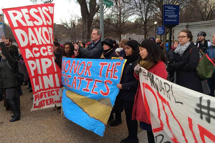 Acitivists who oppose the Dakota Access Pipeline protest outside the White House on Jan. 24, 2017, after President Trump’s executive orders earlier in the day to continue construction. 