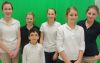 Members of the St. Patrick&#039;s Social Media Group Allyson Manak Majer, Rosemary Melski, Nicole Novaciah Pearce and Grace Schofield (back row left to right) along with Angelo Giustizia and Angelica Batog pose in front of the green screen they used to shoot their winning video. 