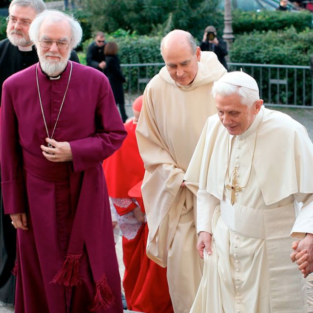 Pope Benedict XVI walking up stairs as he arrives with Archbishop Rowan Williams, left, for vespers at the Basilica of St. Gregory on the Caelian Hill in Rome March 10. 