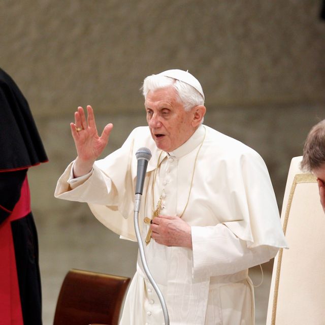 Pope Benedict XVI gives a blessing at the end of his weekly audience at the Vatican Jan. 25. Consecrated life entails giving oneself completely to God and living for others, Pope Benedict XVI said.