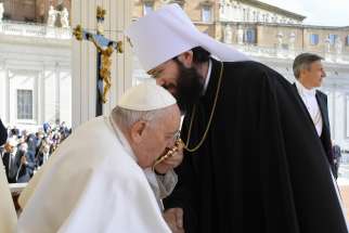 Pope Francis kisses the encolpion, an icon Orthodox and Byzantine Catholic bishops wear instead of a pectoral cross, as he greets Metropolitan Anthony of Volokolamsk, director of external relations for the Russian Orthodox Church, at the end of the pope&#039;s general audience May 3, 2023, in St. Peter&#039;s Square at the Vatican.