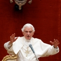 Pope Benedict XVI gives a blessing as he leads his weekly general audience at his summer residence in Castel Gandolfo, Italy