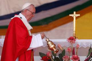 Pope Francis censes the altar as he celebrates Mass in Barthelemy Boganda Stadium in Bangui, Central African Republic, Nov. 30.