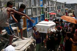 Men carry the coffin of Vicente Batiancila Oct. 23, who police say was among five victims of recent drug-related killings, during his funeral in Manila, Philippines. As Filipinos remembered their departed on All Souls&#039; Day, the country&#039;s church leaders called on the faithful to also pray for those who fell victim in the government&#039;s all-out war against illegal drugs.