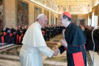 Pope Francis greets Cardinal Beniamino Stella, prefect of the Congregation for Clergy, during an audience with participants in the plenary assembly of the Congregation for Clergy at the Vatican June 1, 2017. Pope Francis has expanded the ranks of the top members of the College of Cardinals, naming as &quot;cardinal bishops&quot; Cardinal Stella and Cardinal Luis Antonio Tagle, prefect of the Congregation for the Evangelization of Peoples.