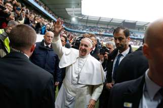Pope Francis greets people before celebrating Mass at the Swedbank Stadium in Malmo, Sweden, Nov. 1.