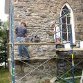 Masonry repairs led by Brian Peever, right, are done on St. Patrick’s Church in Kearney, Ont.