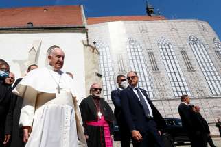 Pope Francis leaves after leading a meeting with priests, men and women religious, seminarians and catechists at the Cathedral of St. Martin in Bratislava, Slovakia, Sept. 13, 2021.