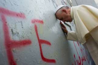 Pope Francis stops in front of the Israeli security wall in Bethlehem, West Bank, May 25.