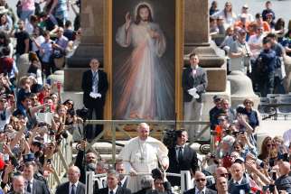 Pope Francis greets the crowd after celebrating Mass marking the feast of Divine Mercy in St. Peter&#039;s Square at the Vatican April 8. 