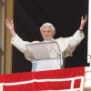 Pope Benedict XVI greets the crowd after praying the &quot;Regina Coeli&quot; from the window of his apartment overlooking St. Peter&#039;s Square at the Vatican April 22. The Pope said preparing children to receive first Communion should be done with both great zeal and moderation.