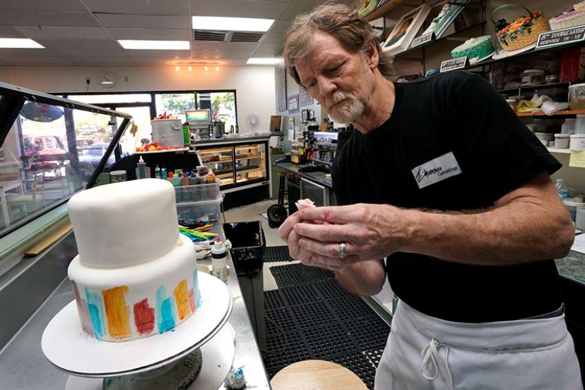 Baker Jack Phillips decorates a cake in his Masterpiece Cakeshop Sept. 21 in Lakewood, Colo. The Supreme Court was set to hear oral arguments Dec. 5 in the case of the baker who cited religious freedom in his refusal to design a wedding cake for a same-sex couple.