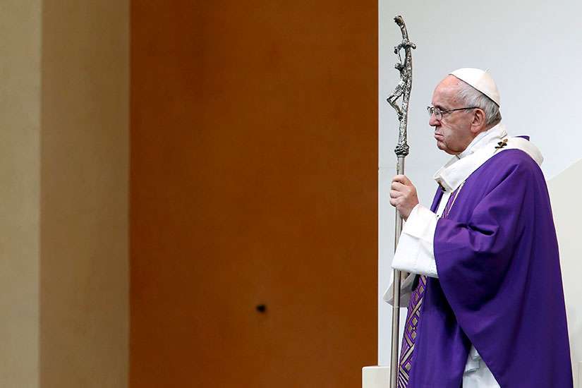 Pope Francis holds his crosier as he celebrates Mass in Carpi, Italy, April 2.