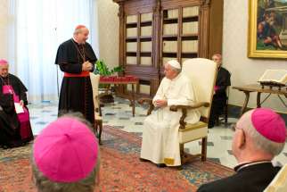 Austrian Cardinal Christoph Schonborn of Vienna talks with Pope Francis during a meeting with Austrian bishops at the Vatican Jan. 30. 