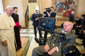 Pope Francis greets Stephen Hawking, a theoretical physicist and cosmologist, during a Nov. 28 meeting with the Pontifical Academy of Sciences at the Vatican.