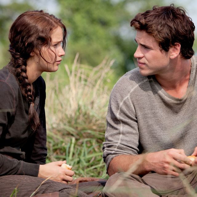 Jennifer Lawrence and Liam Hemsworth star in a scene from the movie &quot;The Hunger Games.&quot;