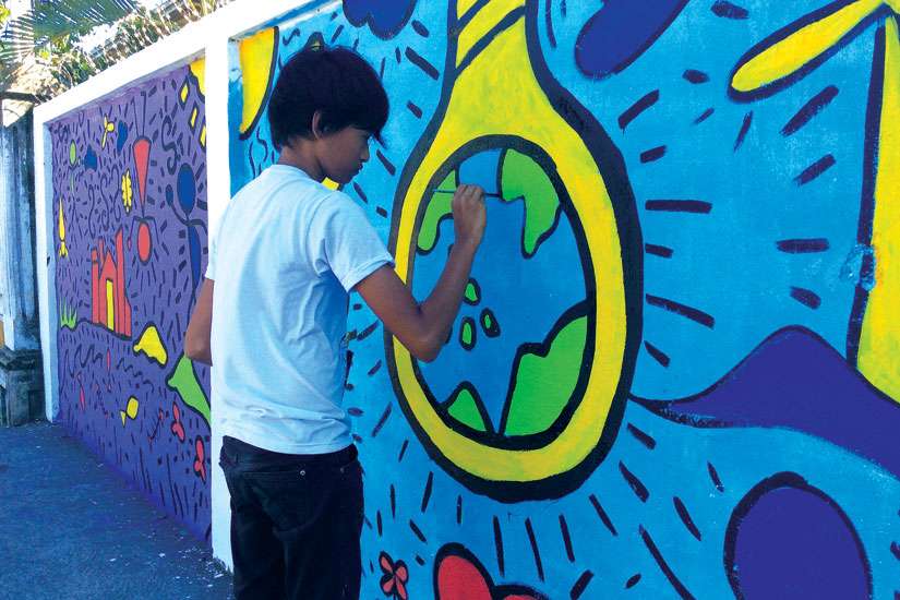 Br. Jaazeal Jakosalem works in youth ministry in Cebu City and Negros Island in the Philippines, educating Filipino youth about Church teaching on the environment. Youth in Jakosalem’s program paint murals to spread the word about climate change and environmental degradation. 