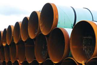 A file photo taken in 2012 shows pipes stacked at a storage yard in the TransCanada Pipe Yard near Cushing, Okla., to be used for the Keystone XL pipeline from Cushing to the Gulf of Mexico. U.S. President Donald Trump reversed his predecessor’s decision to kill the pipeline.