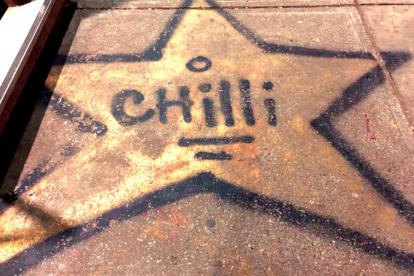 A star drawn on the sidewalk remembers Chilli, “the angel that got away.”