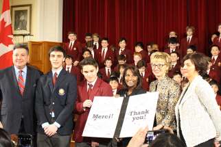 Minister of Finance, Charles Sousa (left), Minister of Tourism, Daiene Vernile (second right), Minister of Education, Indira Naidoo-Harris (middle) receive a &#039;Thank you&#039; card from St. Michael&#039;s Choir School students after the funding announcement was made Feb. 7, 2018.