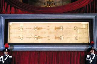 The Shroud of Turin is displayed during a preview for journalists at the Cathedral of St. John the Baptist in Turin, Italy, April 18. A public exposition of the shroud, believed by many to be the burial cloth of Jesus, runs from April 19 through June 24, 2015.