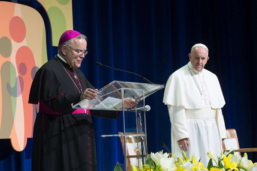 Archbishop Charles J. Chaput of Philadelphia and Pope Francis meet with the World Meeting of Families organizing committee, volunteers and donors at Philadelphia&#039;s international airport Sept. 27, 2015.