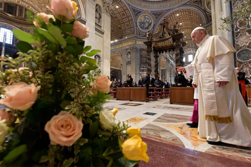Pope Francis walks near flowers prior to delivering his Easter message and blessing &quot;urbi et orbi&quot; (to the city and the world) after celebrating Easter Mass in St. Peter&#039;s Basilica at the Vatican April 4, 2021.