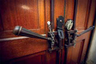 The doors of a London church were locked in late March, but pressure is mounting to re-open.