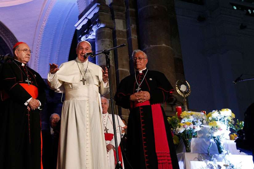 Pope Francis greets the crowd outside the cathedral in Quito, Ecuador, July 6. The Pope is making an eight-day trip to Ecuador, Bolivia and Paraguay.